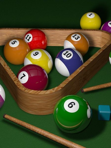 billiard balls with pool sticks and triangle